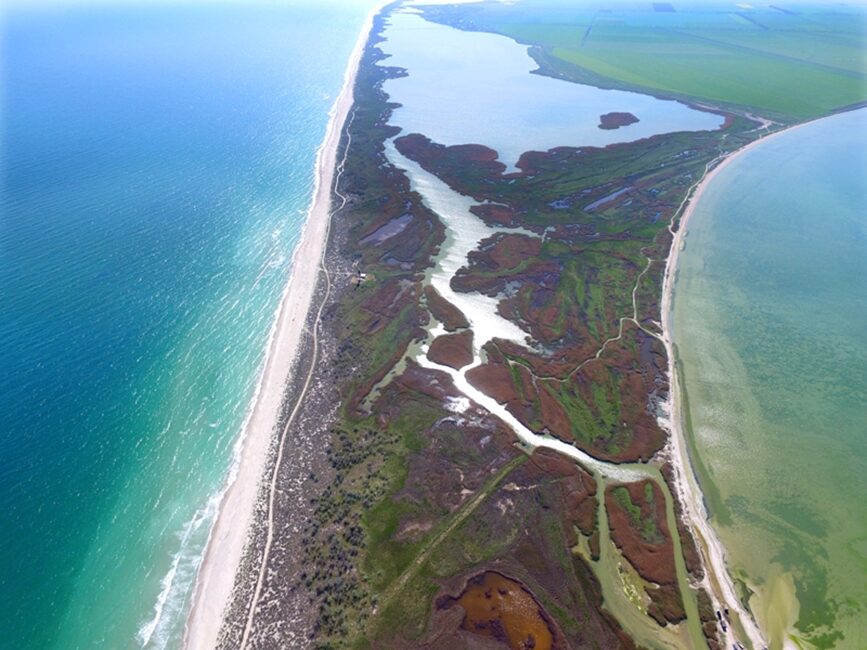 Aerial view of the sandy barrier in Tuzly Lagoons National Nature Park between the lagoons and the Black Sea