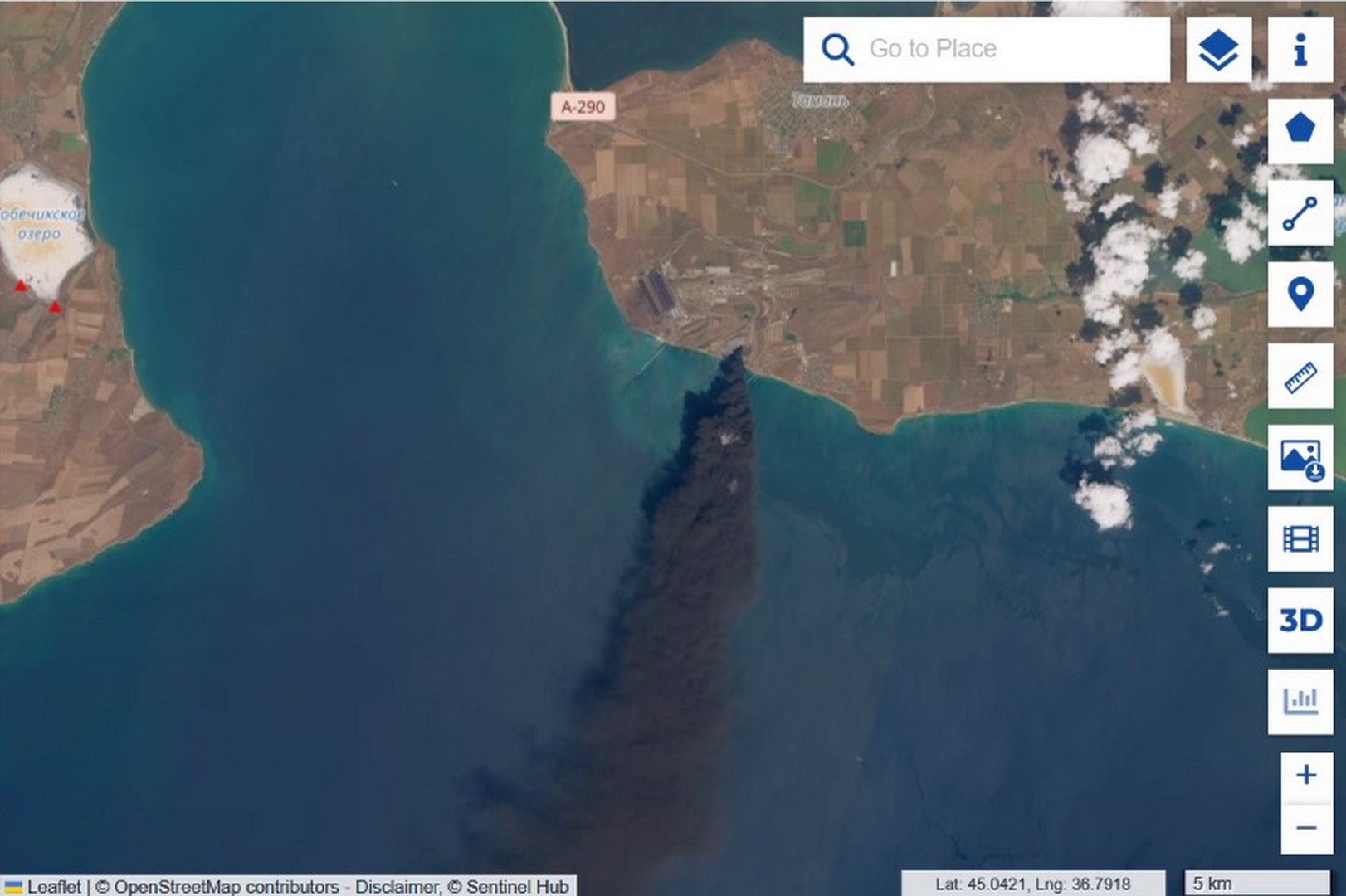 Sentinel-2 wide view of the black smoke plume extending from Taman port over the sea
